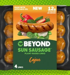 A packet of Beyond Meat's new healthier less processed Sun Sausages in front of a green background
