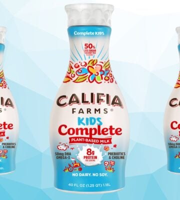 Three bottles of Califia Farms Kids Complete plant-based milk in front of a blue background