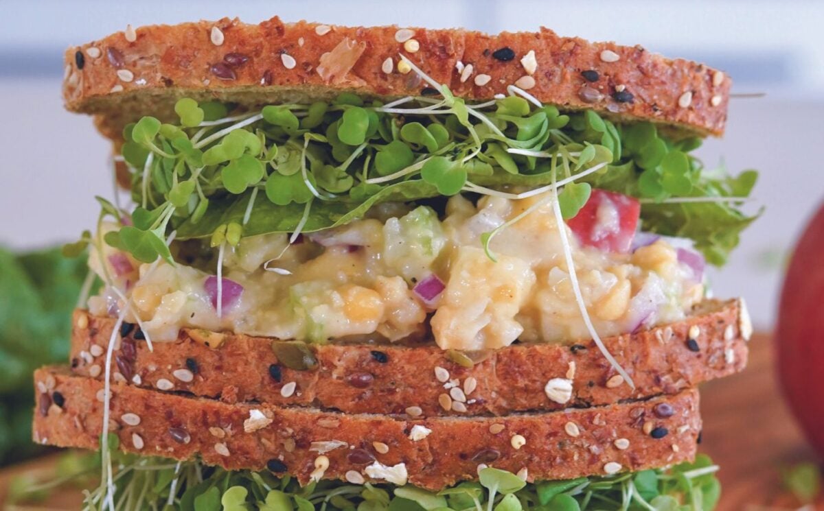 A vegan sandwich made with a chickpea sandwich filling