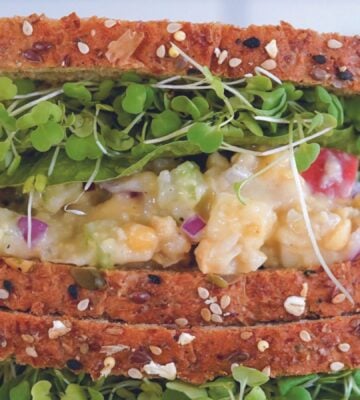 A vegan sandwich made with a chickpea sandwich filling