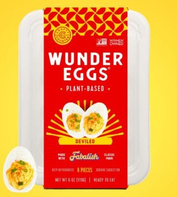 A pack of vegan deviled eggs in front of a bright yellow background