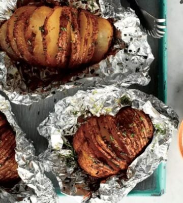 A hasselback sweet potato made to a vegan recipe