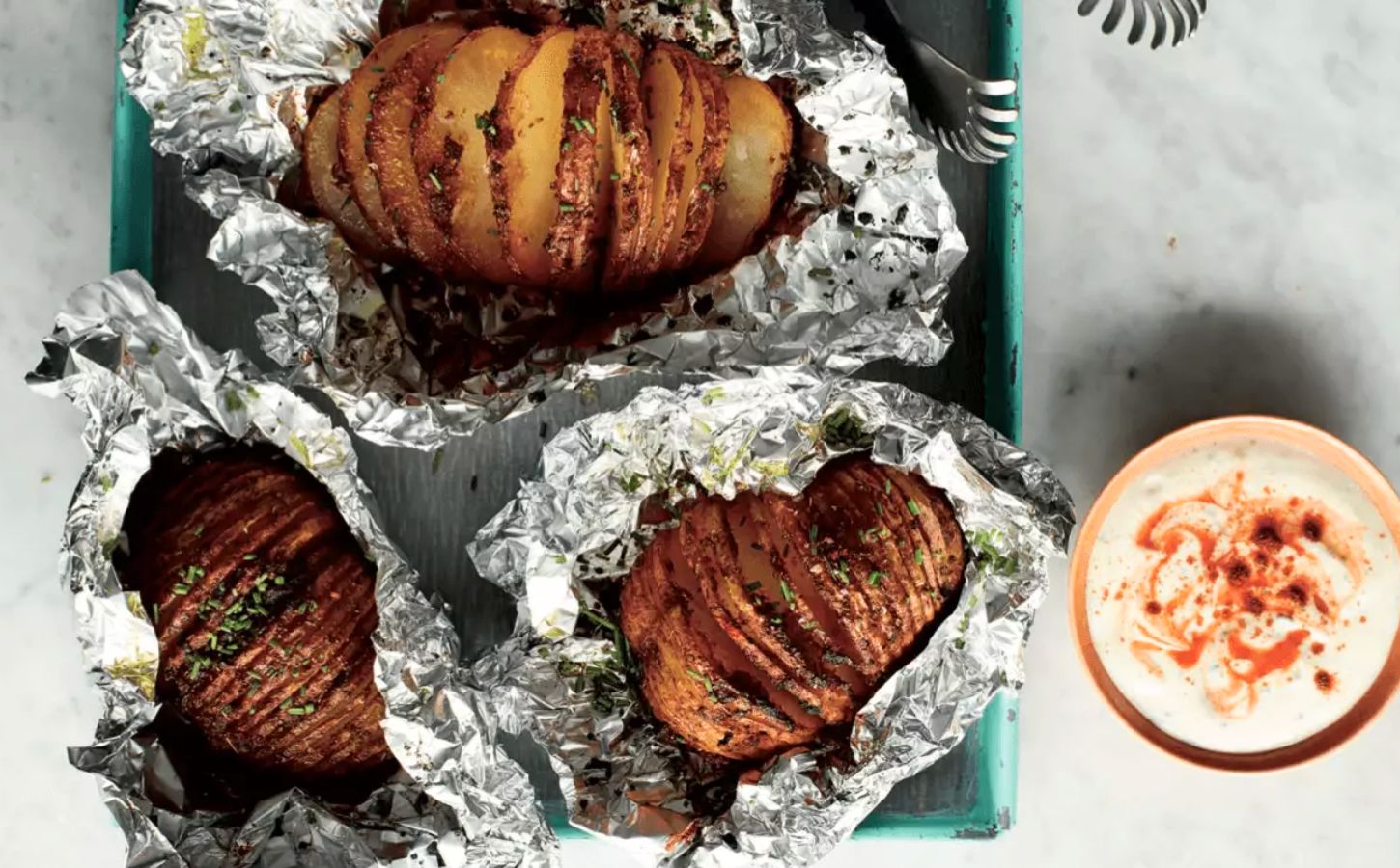A hasselback sweet potato made to a vegan recipe