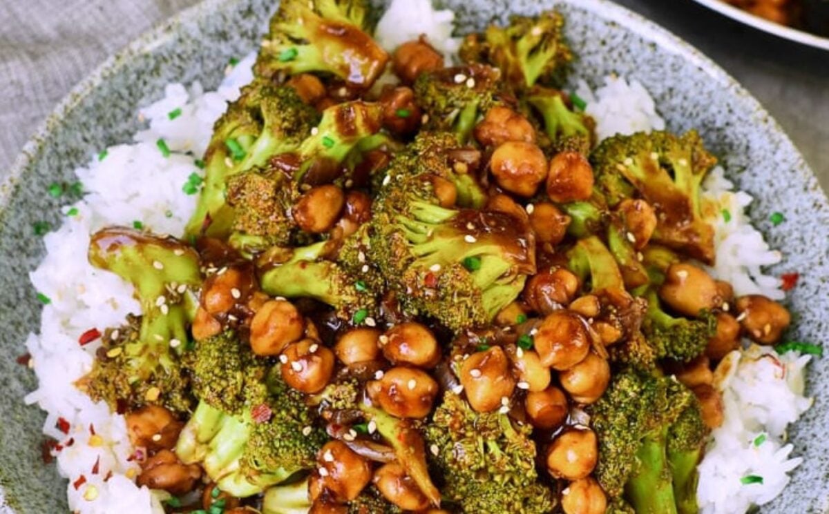 a picture of a garlic broccoli and chickpea stir fry on rice