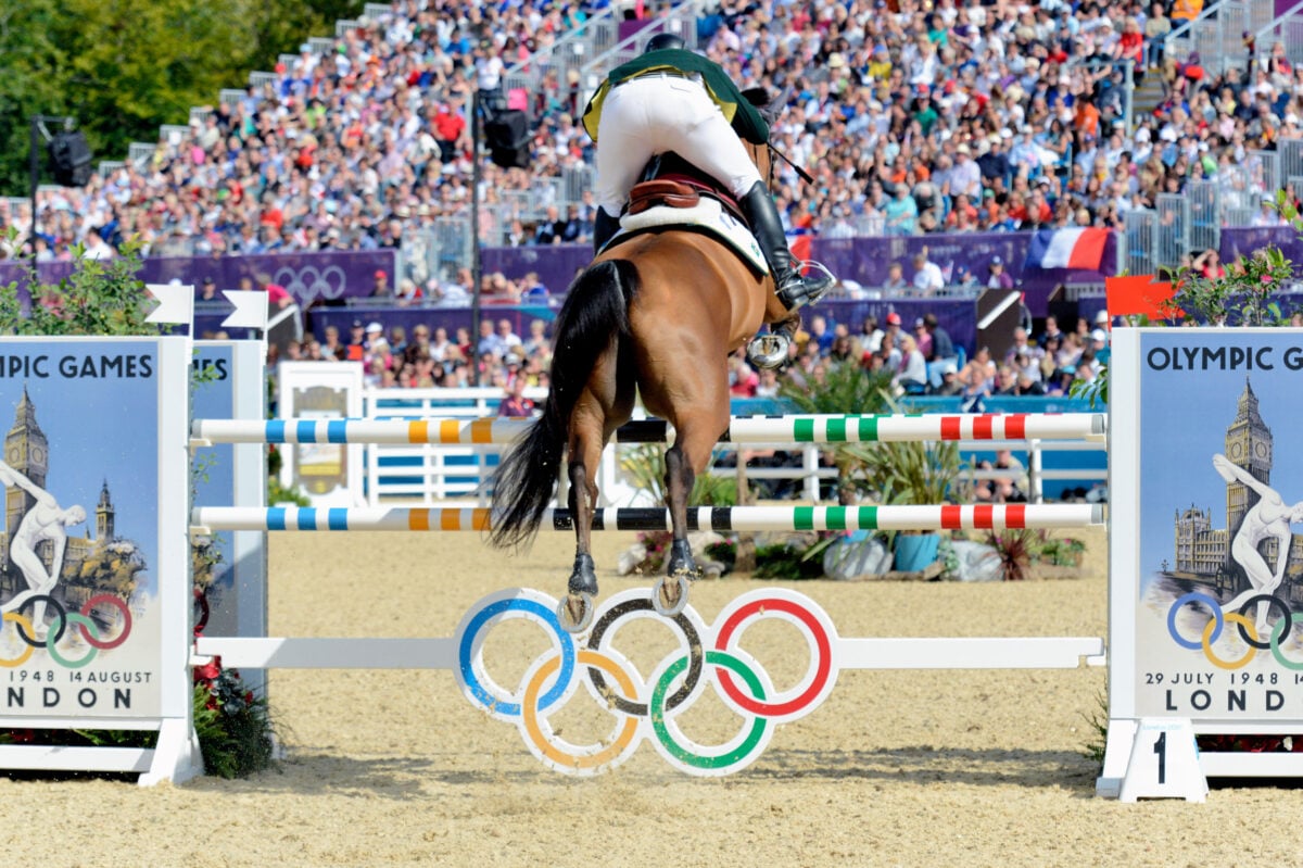 A showjumping Olympian taking part in the sport at the Olympics