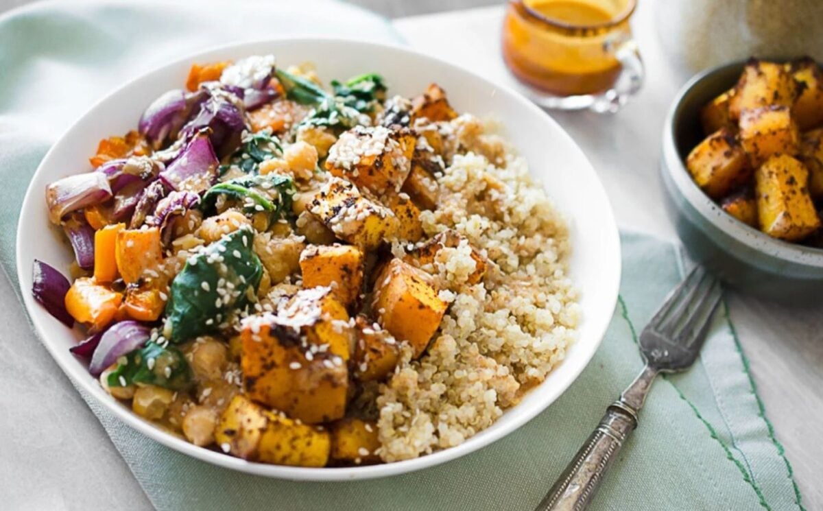 Photo shows a roasted squash and quinoa buddha bowl recipe by Ashley Madden of Rise Shine Cook