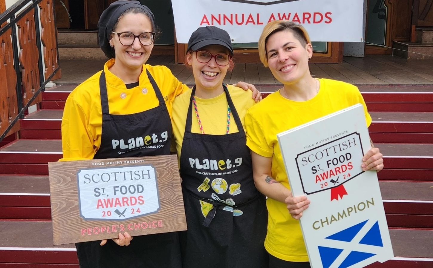 The three owners of Planet G, a vegan food brand from Scotland, holding their Scottish Street Food award