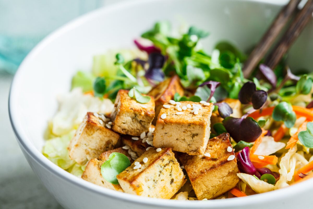 A salad featuring tofu, a complete source of vegan protein