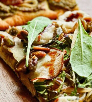 A vegan pistachio and pear pizza made to a plant-based recipe