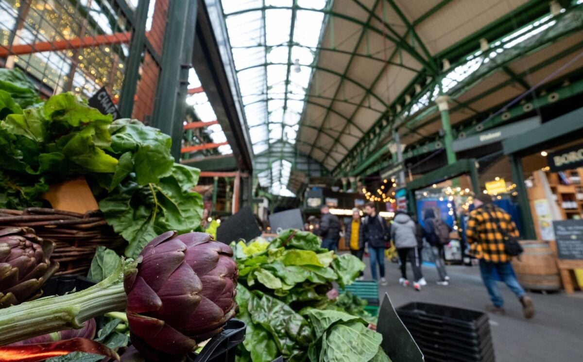 Photo shows produce on stalls at Borough Market in London, UK