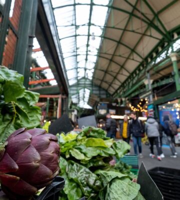 Photo shows produce on stalls at Borough Market in London, UK