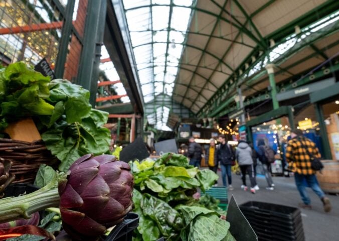 Photo shows produce on stalls at Borough Market in London, UK