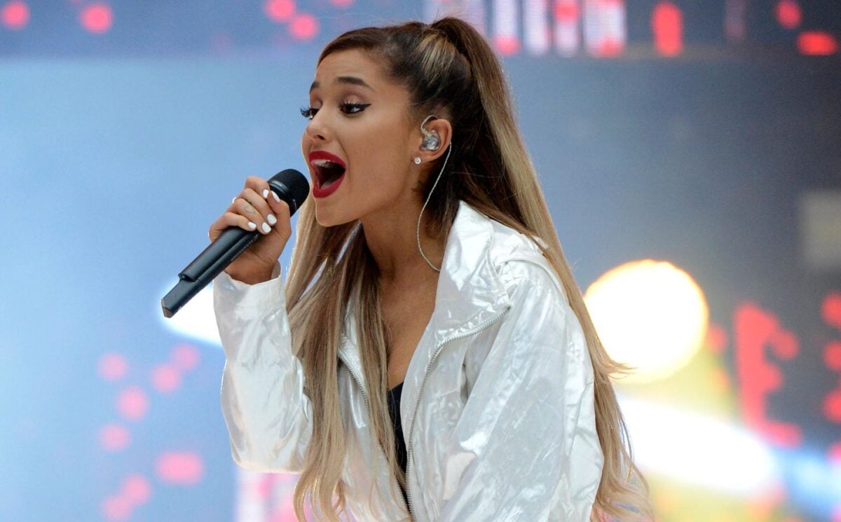 Photo shows Ariana Grande performing onstage