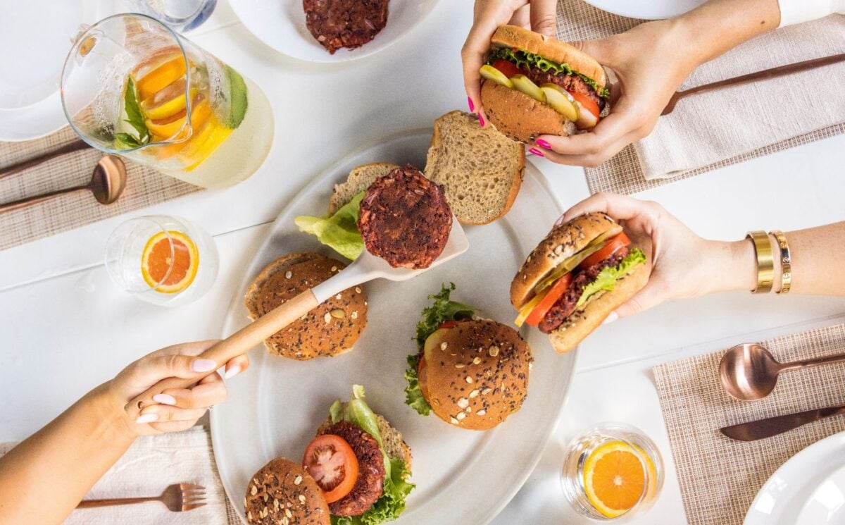 a picture of beauty beet and bean burgers being served to a group