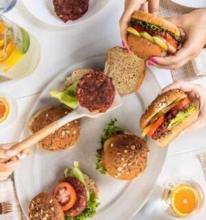 a picture of beauty beet and bean burgers being served to a group