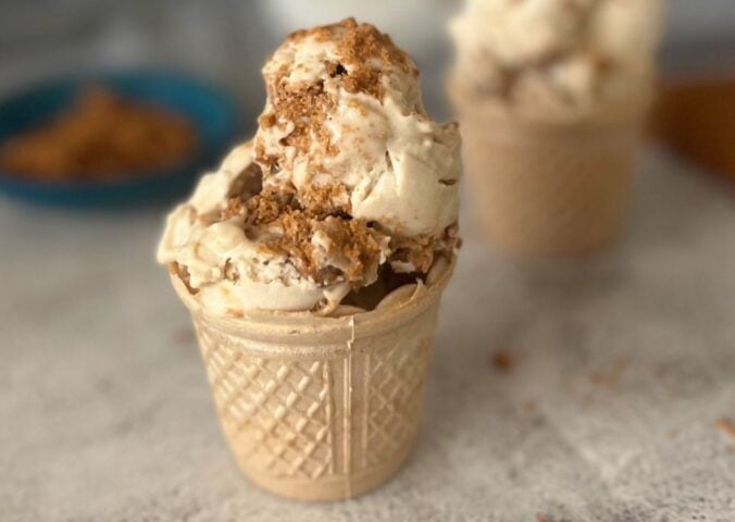 A cone full of vegan and dairy-free Biscoff ice cream