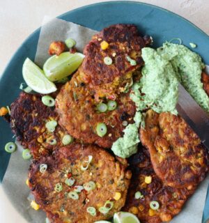 a picture of vegan crispy corn fritters with avocado dip