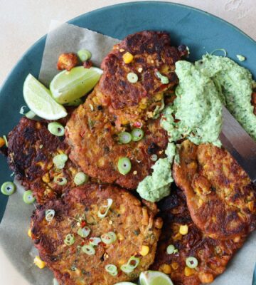 a picture of vegan crispy corn fritters with avocado dip