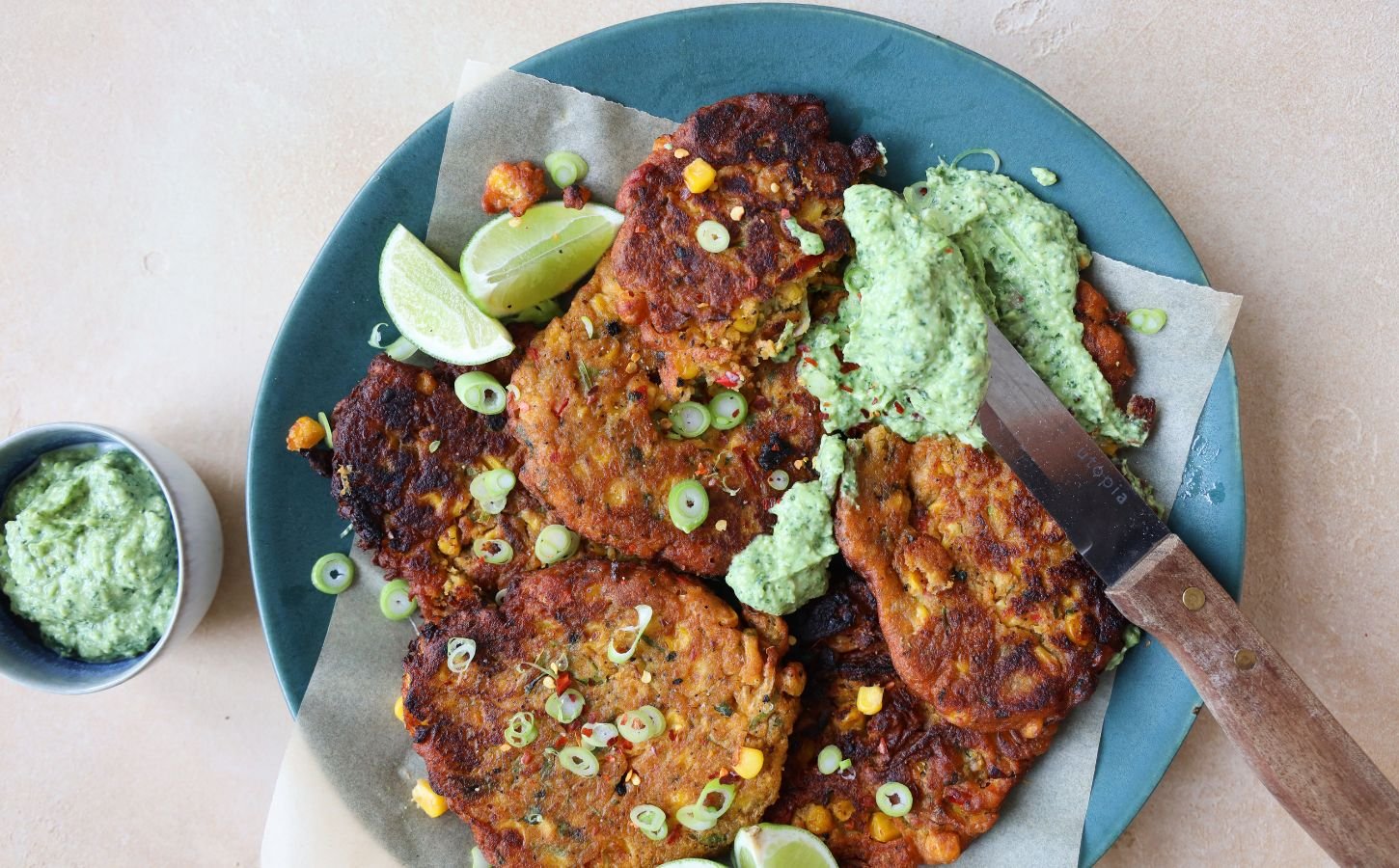 a picture of vegan crispy corn fritters with avocado dip