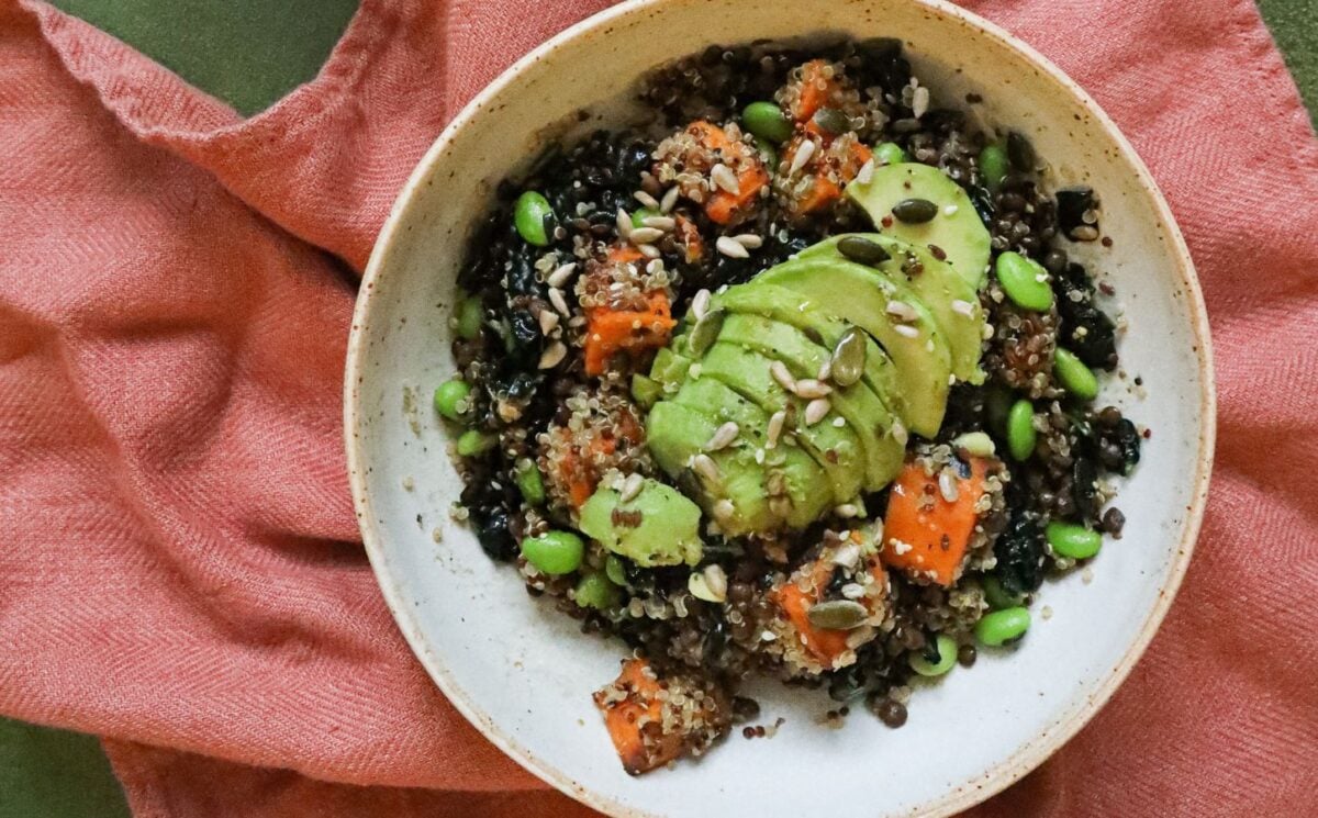 a picture of an energizing post-gym workout salad made with sweet potato, edamame, lentils, orange, and avocado