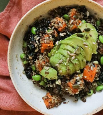 a picture of an energizing post-gym workout salad made with sweet potato, edamame, lentils, orange, and avocado