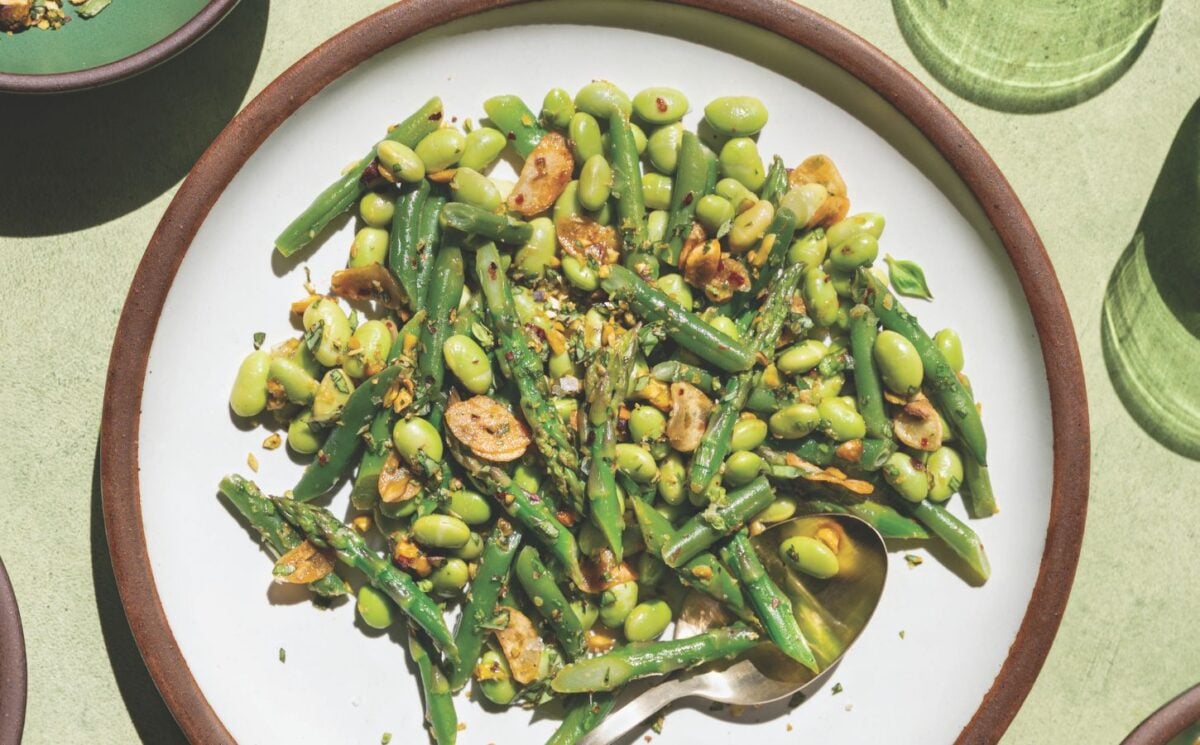 a picture of garlicky asparagus and beans with lemon-infused olive oil as well as, pistachios, garlic chips, and chili