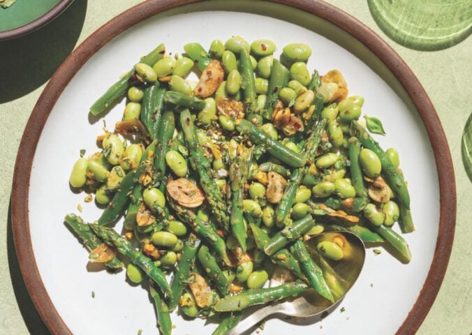 a picture of garlicky asparagus and beans with lemon-infused olive oil as well as, pistachios, garlic chips, and chili