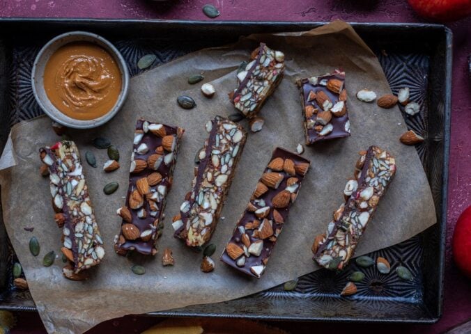 a picture of vegan energy bars made with apple, dates, nuts, seeds, and chocolate