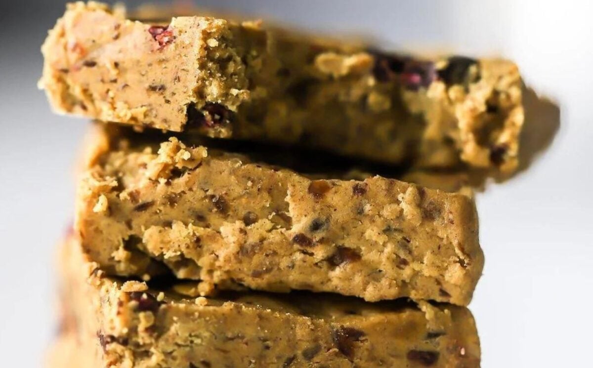 a picture of stacked banana and cinnamon protein bars made with dates, cashew butter, and vegan protein powder