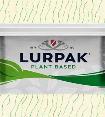 A pack of vegan Lurpak in front of a green and cream patterned background