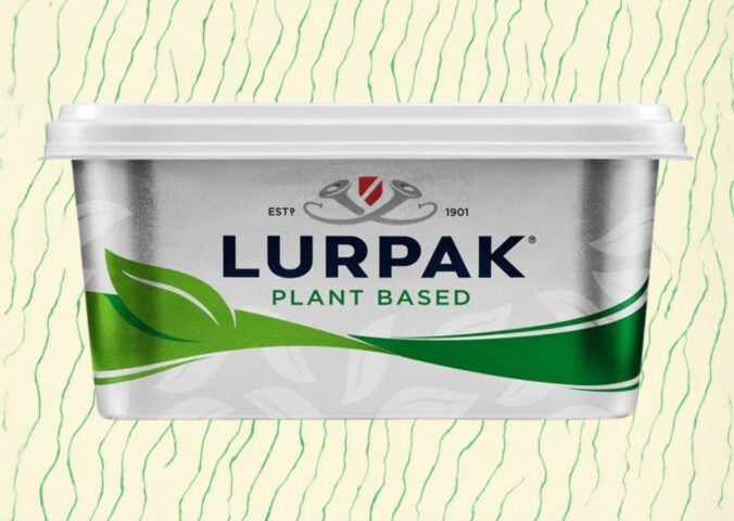 A pack of vegan Lurpak in front of a green and cream patterned background