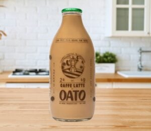 A bottle of caffe latte made with oat milk available from a UK milk round