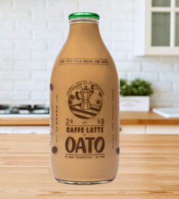 A bottle of caffe latte made with oat milk available from a UK milk round