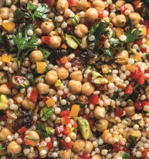 a picture of a pearl couscous and chickpea salad with preserved lemon, pepper, and other ingredients