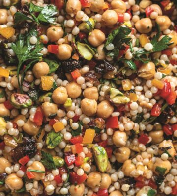 a picture of a pearl couscous and chickpea salad with preserved lemon, pepper, and other ingredients