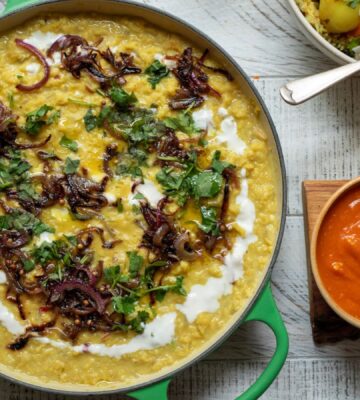 A pot of apple and coconut dahl cooked to a vegan recipe