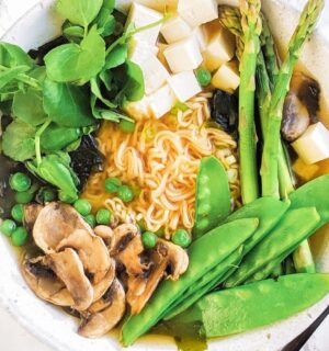 a picture of a spring miso ramen bowl with gluten-free ramen noodles, mushrooms, tofu, and greens