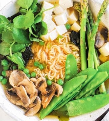 a picture of a spring miso ramen bowl with gluten-free ramen noodles, mushrooms, tofu, and greens