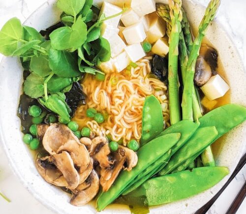 a picture of a spring miso ramen bowl with gluten-free ramen noodles, mushrooms, tofu, and greens