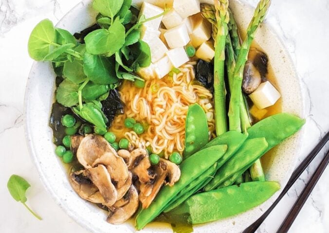 a picture of a spring miso ramen bowl with gluten-free ramen noodles, mushrooms, tofu, and greens