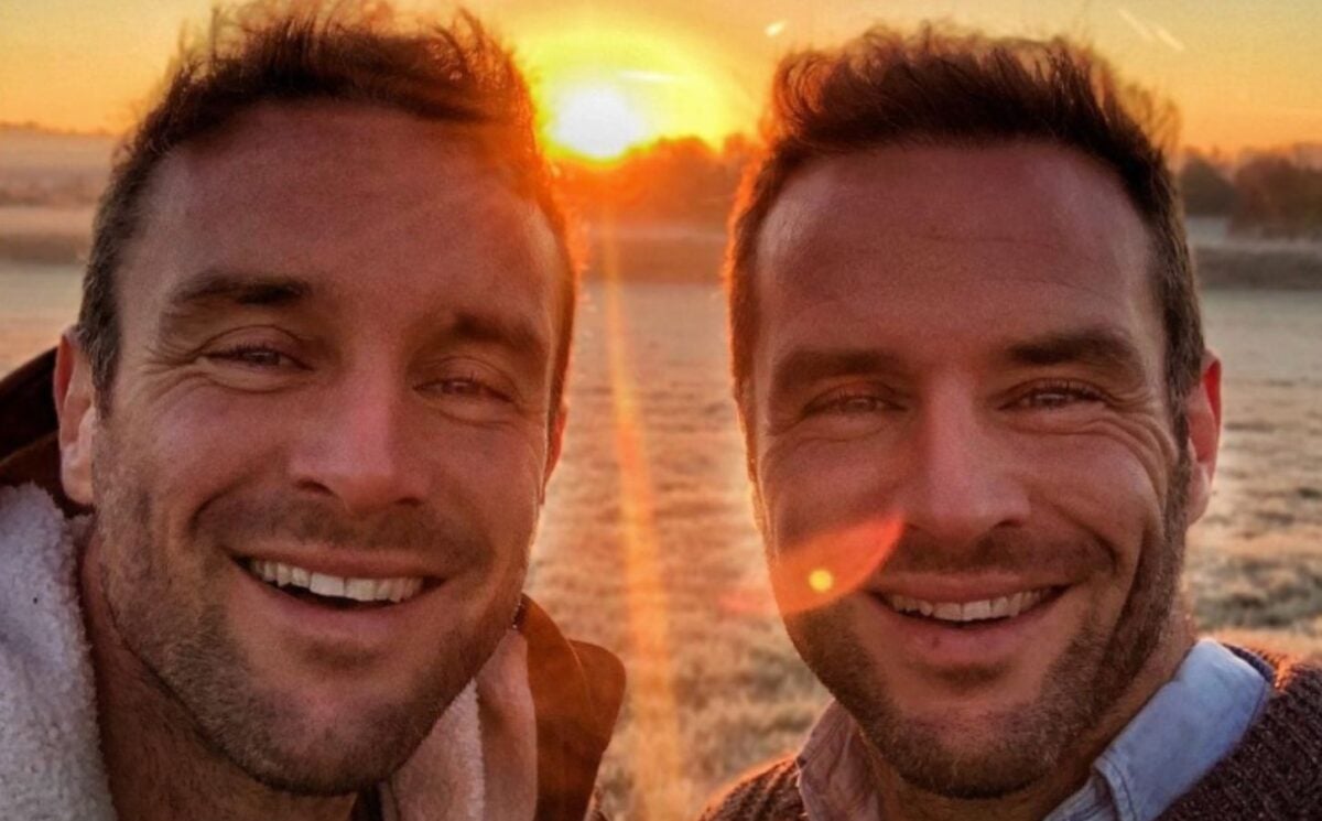 The Happy Pear owners David and Stephen Flynn pose for a selfie in front of a sunset