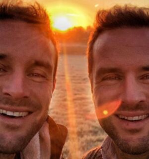 The Happy Pear owners David and Stephen Flynn pose for a selfie in front of a sunset