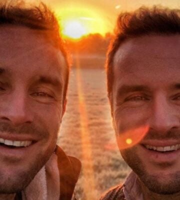 The Happy Pear owners David and Stephen Flynn pose for a selfie in front of a sunset