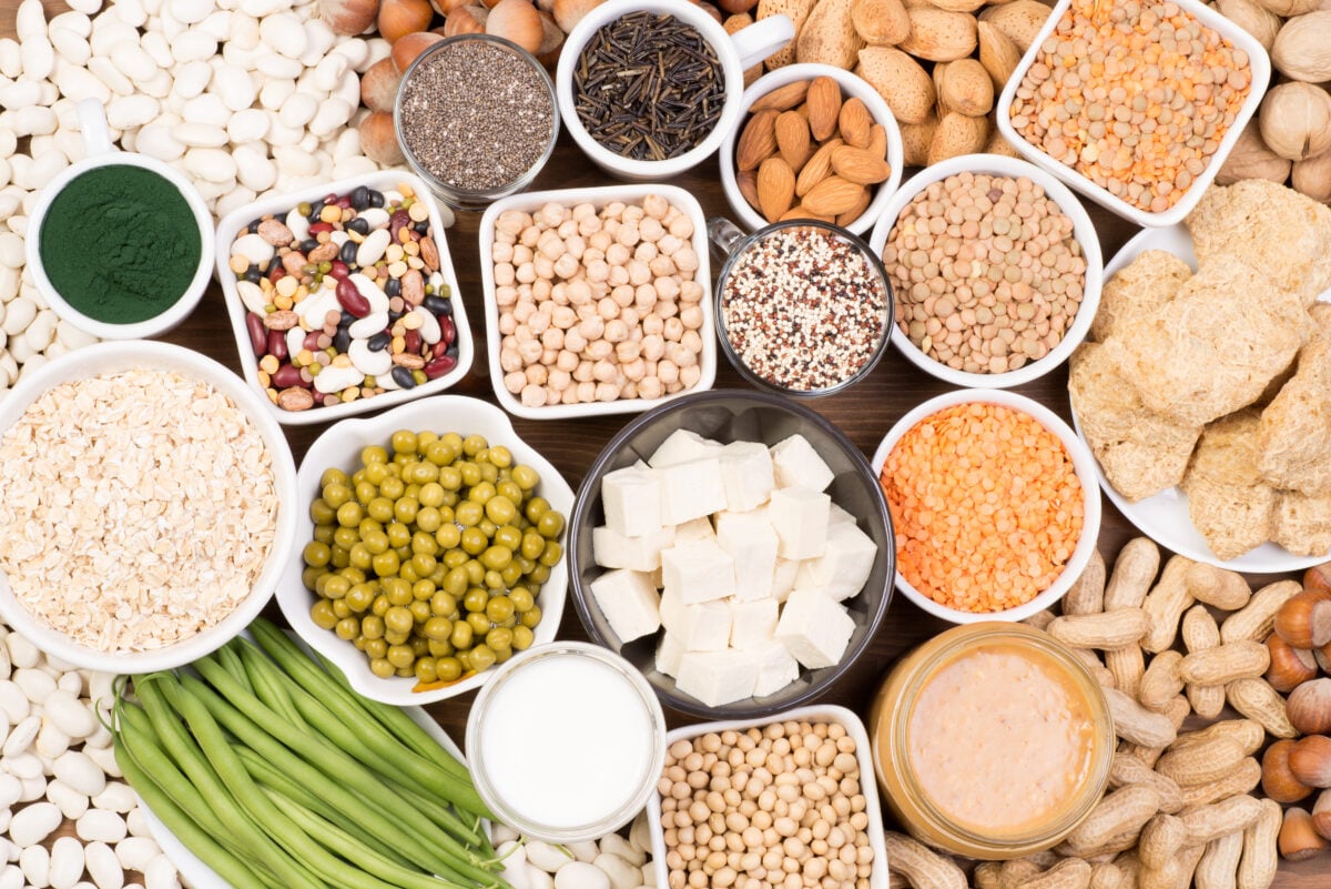 A selection of vegan sources of protein, including nuts, seeds, and tofu