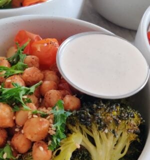 a picture of a gluten-free, high-protein, vegan quinoa power bowl with roasted veggies, quinoa, and chickpeas