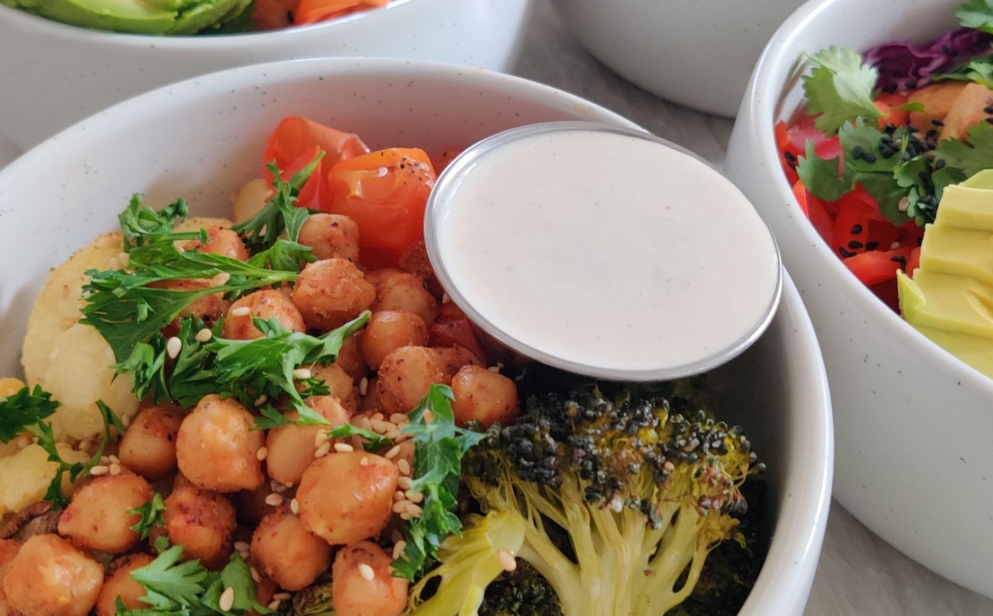 a picture of a gluten-free, high-protein, vegan quinoa power bowl with roasted veggies, quinoa, and chickpeas