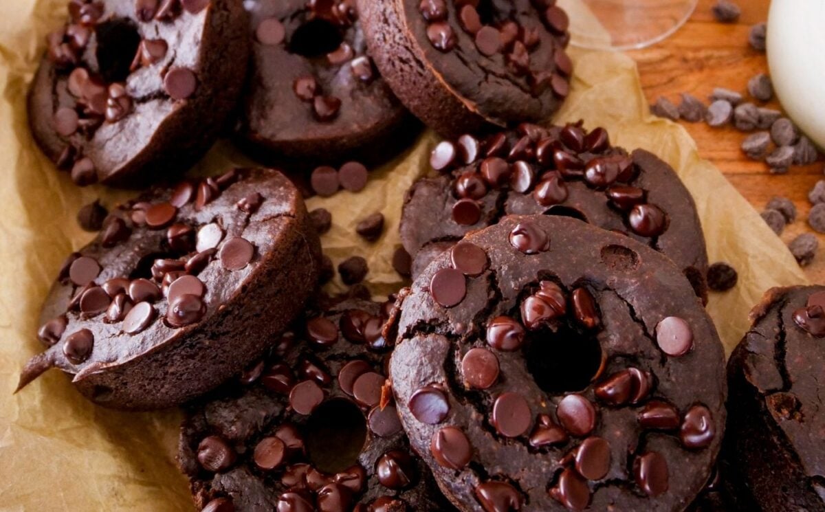 a picture of blender dark chocolate donuts topped with vegan chocolate chips