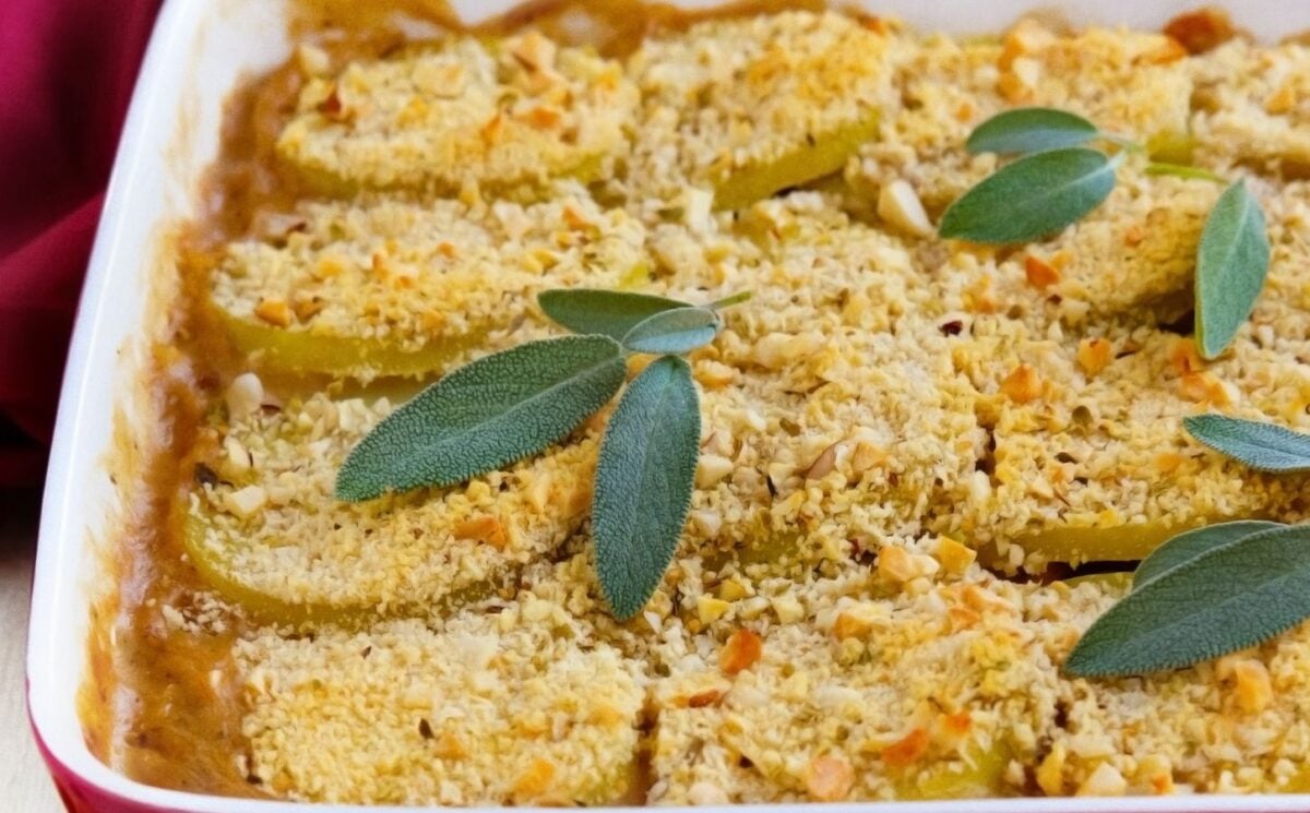 a picture of a mushroom, leek, and borlotti bean pie topped with a herbed potato crust