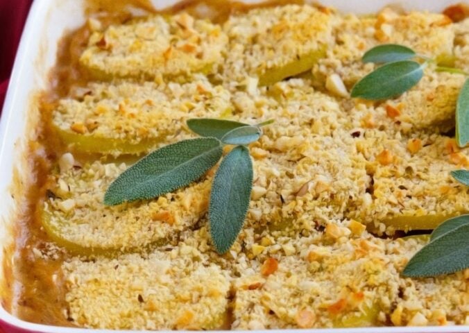 a picture of a mushroom, leek, and borlotti bean pie topped with a herbed potato crust