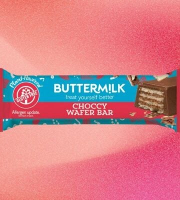 A bar of Buttermilk wafer chocolate bar in front of a light red background